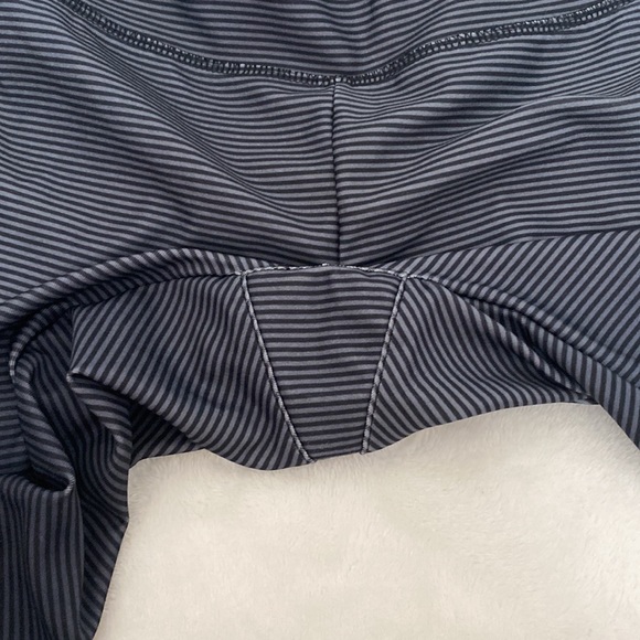 Dansko black and grey striped leggings. Cute detail of tear drop cutouts on legs - Picture 2 of 6